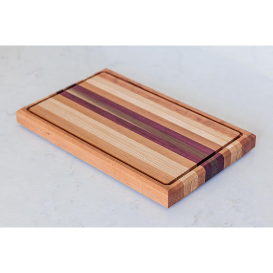 Large Hardwood cutting board with juice groove! Walnut, purple heart, hickory, hard maple, and cherry. Approx 17"x10.5"x1.5"