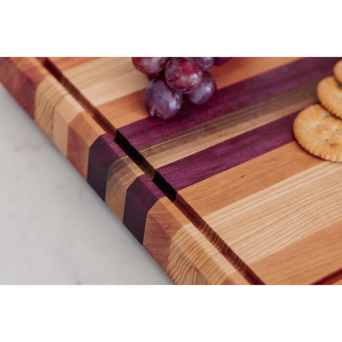 Large Hardwood cutting board with juice groove! Walnut, purple heart, hickory, hard maple, and cherry. Approx 17"x10.5"x1.5"