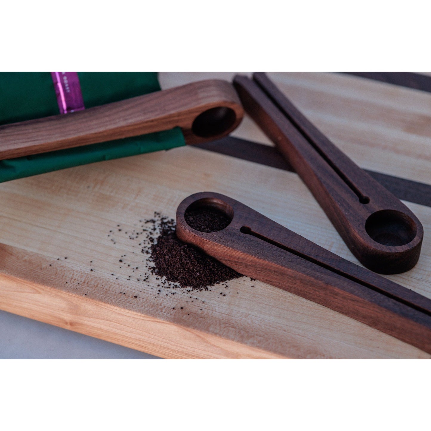 Walnut coffee scoop and bag sealer. This versatile tool allows you to measure the perfect amount of coffee and securely seal the bag for freshness. Crafted from walnut, it adds a touch of elegance to your coffee routine.